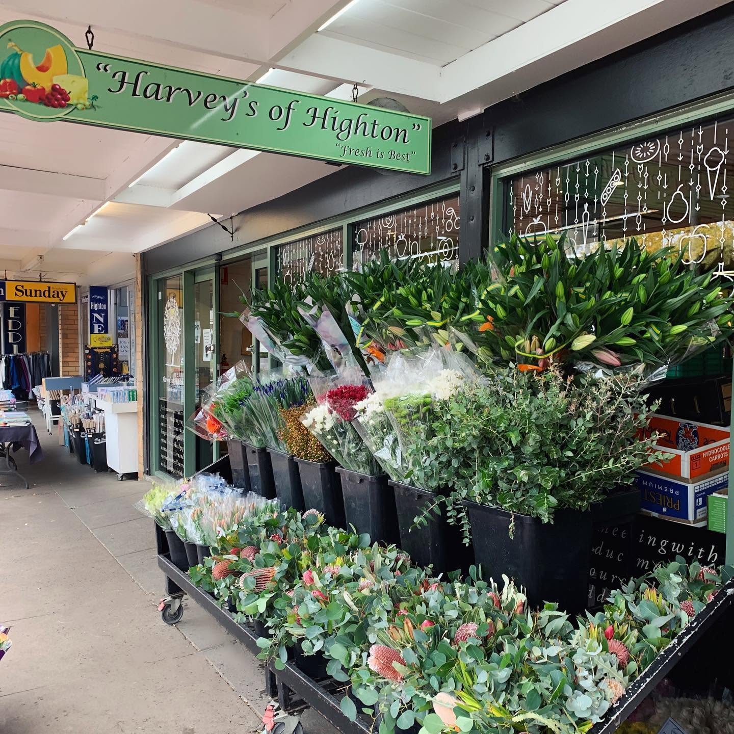 Harveys of Highton storefront with its green sign and fresh flower display
