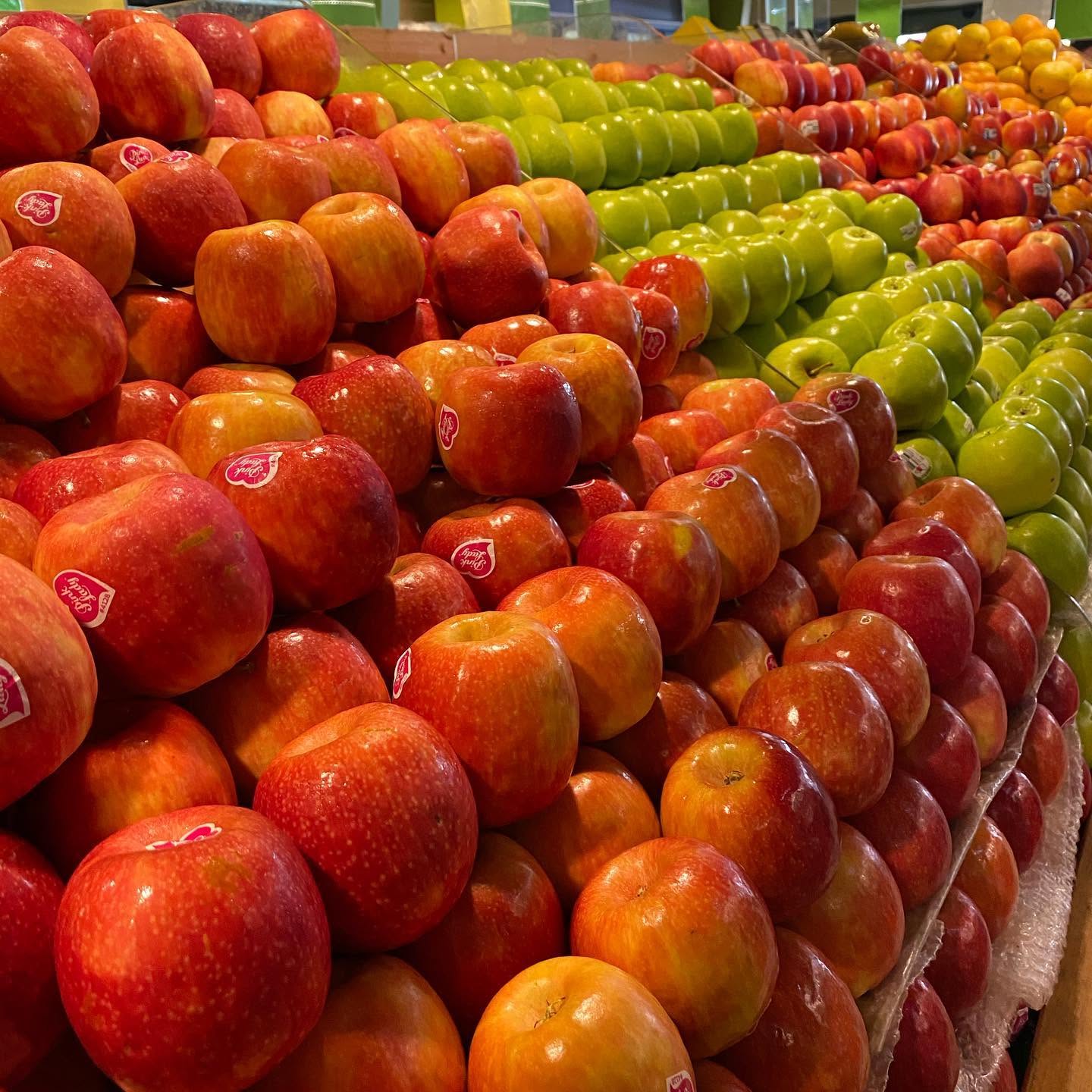 A colourful display of red and green apples at Harveys